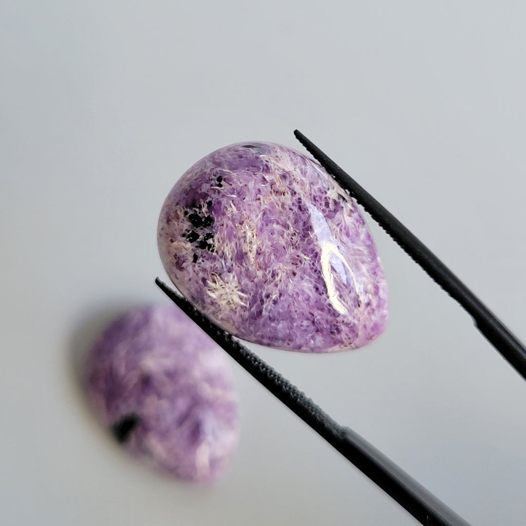 31.48tcw matching pair of Charoite Cabochons