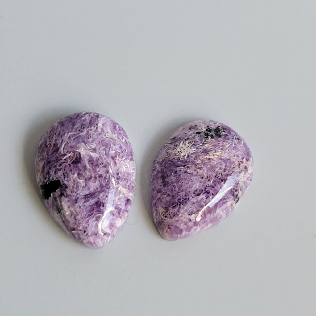 31.48tcw matching pair of Charoite Cabochons