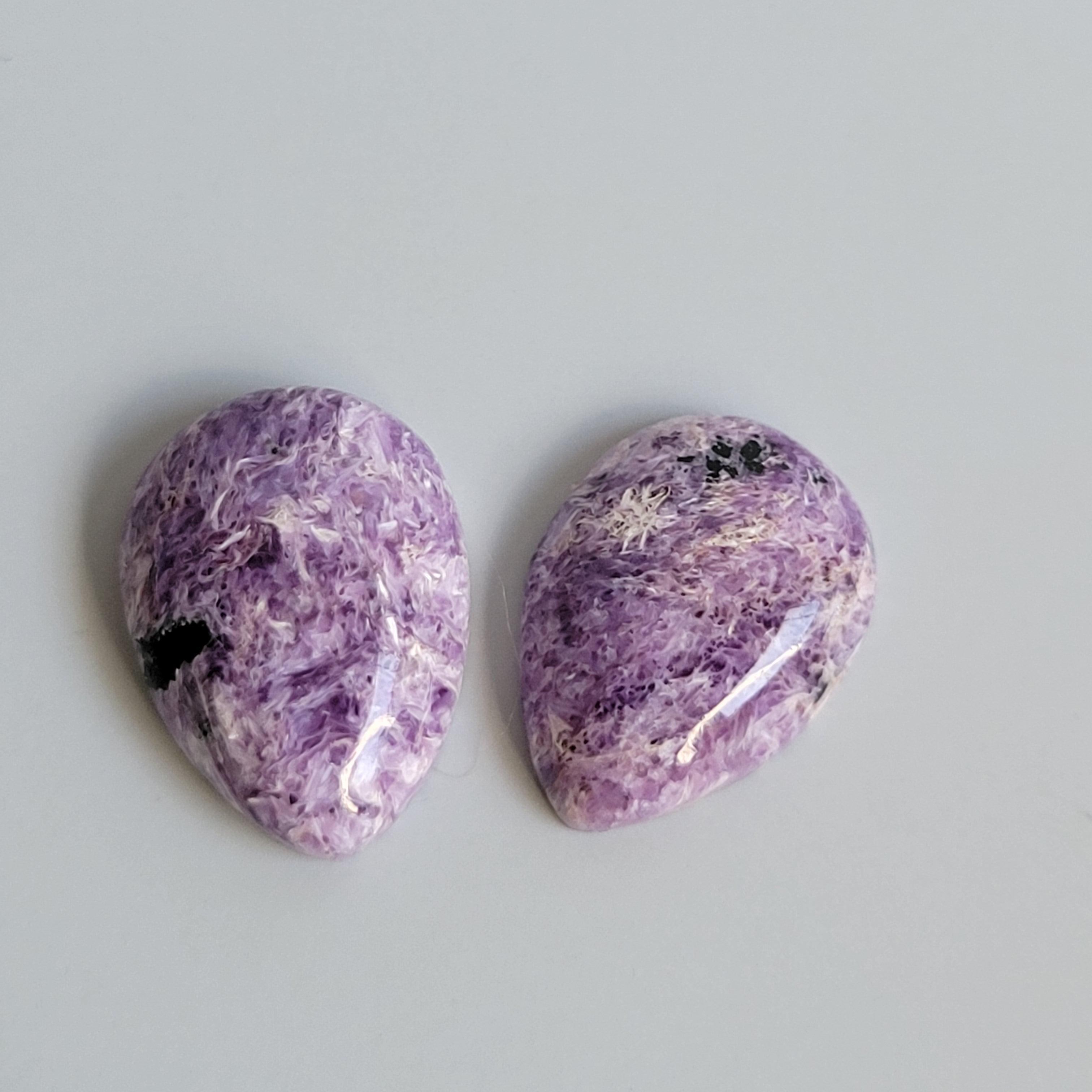 31.48tcw matching pair of Charoite Cabochons